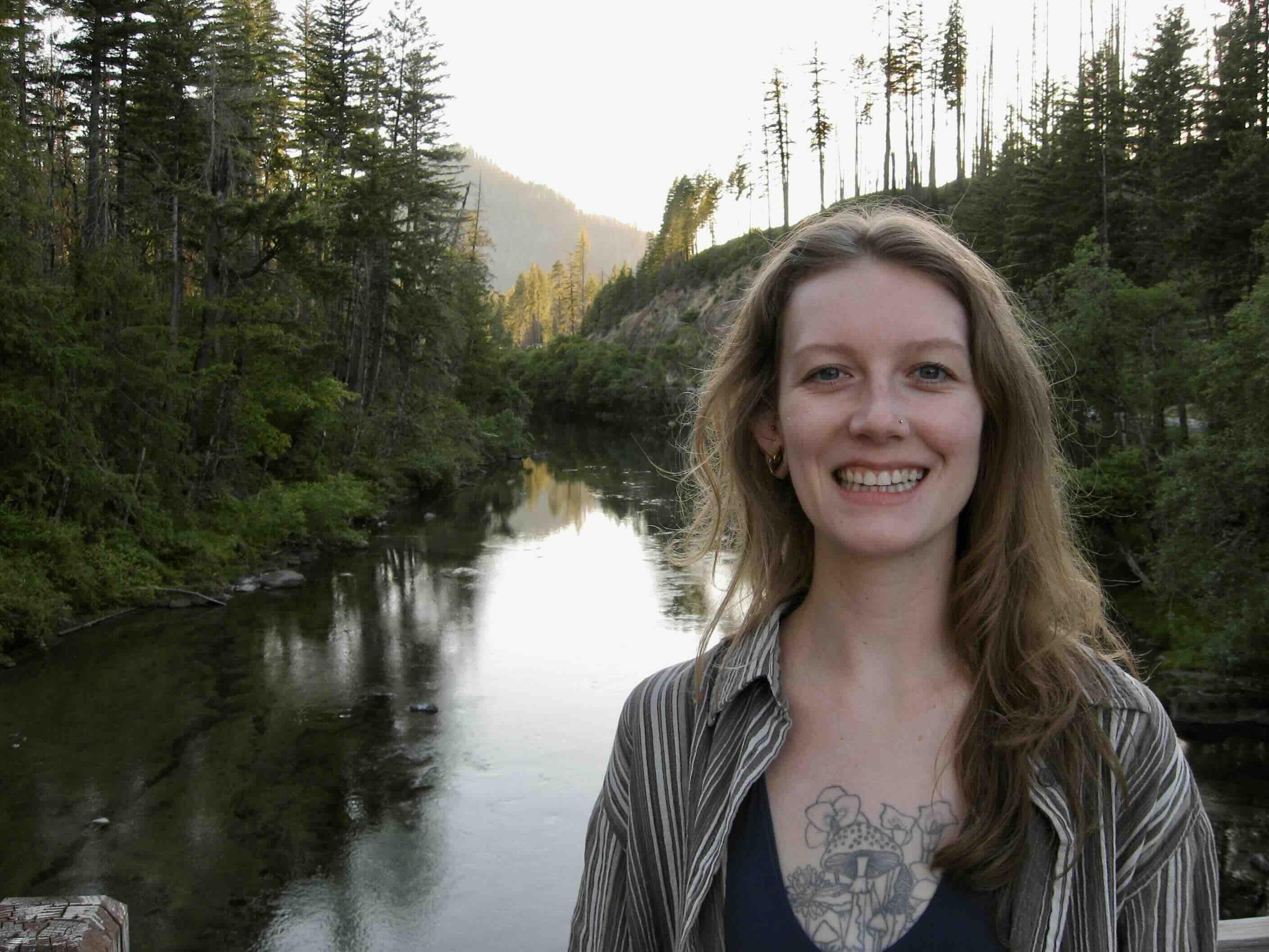 Kylie smiling in front of a river